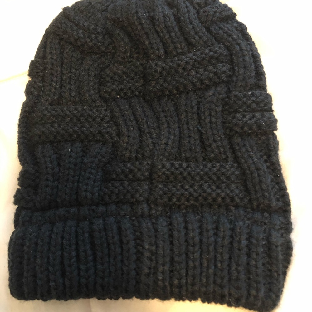 Black crocheted sock hat with ponytail opening
